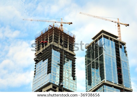 Construction of skyscrapers from glass, a steel and concrete of a complex of the international business centre