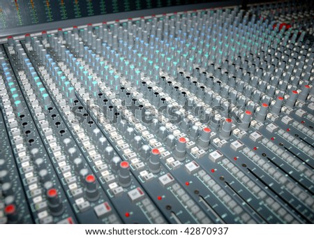 Audio mixing console in a recording studio. Faders and knobs of a sound mixer.