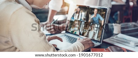 Office business team concept. Video conference using laptop with remote working teammates. Wide screen orientation Stockfoto © 