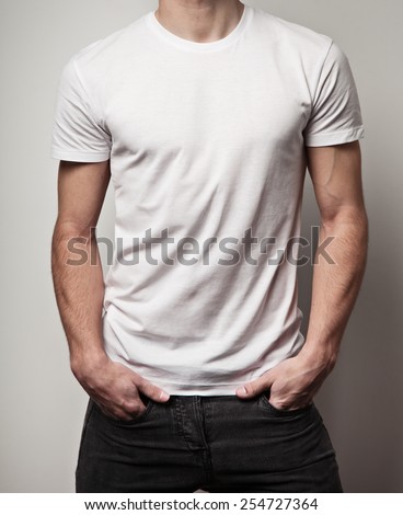White blank t-shirt on young athletic man, front