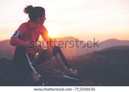 Similar – Image, Stock Photo Athletic woman resting after workout at stadium