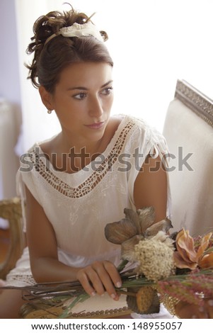 young lady with flowers in her hands