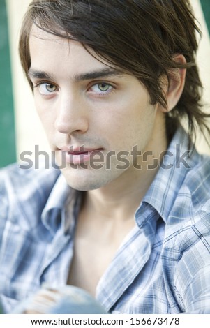 young man with brown hair and clear eyes