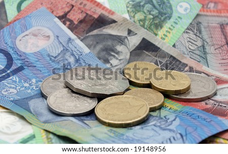 A pile of Australian banknotes and coins