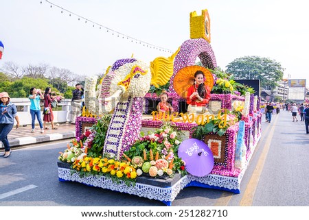 CHIANG MAI,THAILAND-FEBRUARY 07 :Unidentified peoples are in parade with fresh flowers decorate car in annual 39th Chiang Mai Flower Festival,  on February 07, 2015 in Chiang Mai,Thailand.