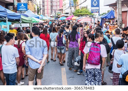 CHIANG MAI,THAILAND - AUGUST 08 : People walk among stalls at famous Saturday walking street market Wualai on August 08, 2015. Market is opened every Saturday from 4pm till midnight.