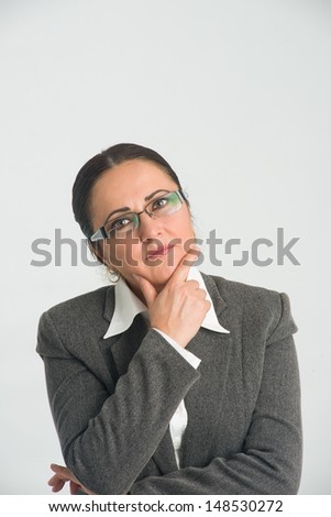 Middle aged business woman is trying to find a solution to a problem