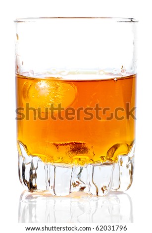 Glass containing rum, whiskey or any other golden liquor with ice on a white background