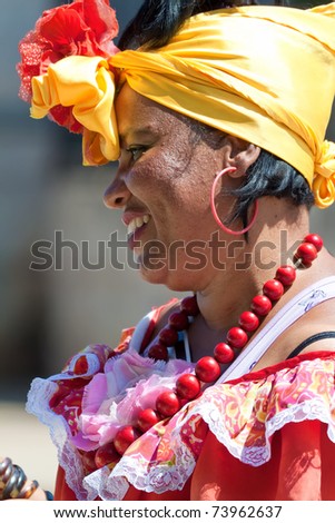 HAVANA-MARCH 25:Young Woman with typical clothes and accessories March 25 ,2011 in Havana.People dressed in a way that represents the cuban nationality can still be found in the streets of Old Havana