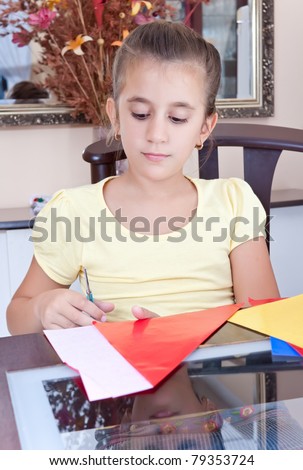 Latin girl working on her art school project at home