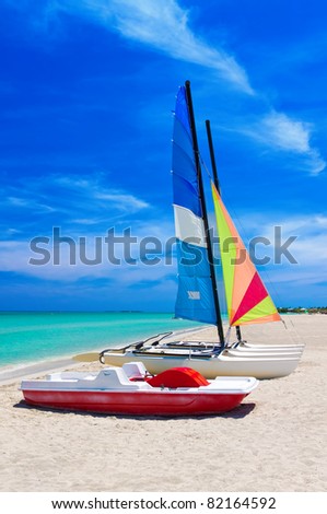 Catamaran and water bikes landed on the beautiful beach of Varadero in Cuba