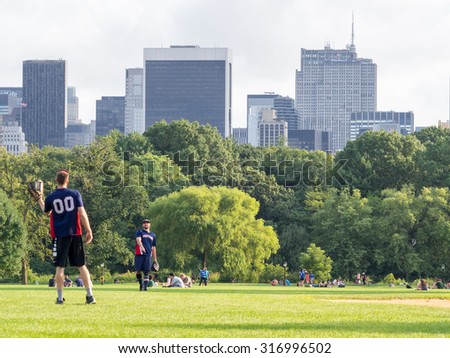 NEW YORK,USA - AUGUST 19,2015 People practicing sports at the Great Lawn in New York Central Park