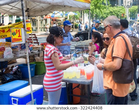 NEW YORK,USA - AUGUST 15,2015 : Stand selling food at a street fair next to the Rockefeller Center in New York City