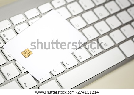 Blank Credit Card With Electronic Chip On Keyboard
