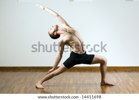 Man Performing Yoga. Head And Torso Leaning Back, Feet Positioned Apart ...