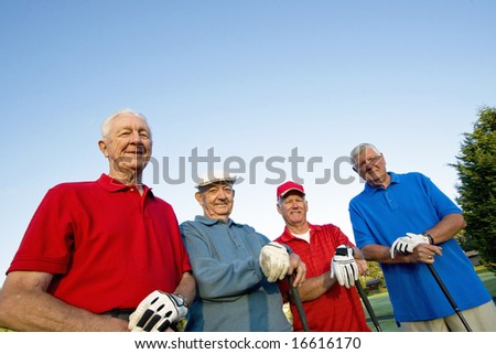 Group of Four Senior Golfers. Horizontally framed shot.