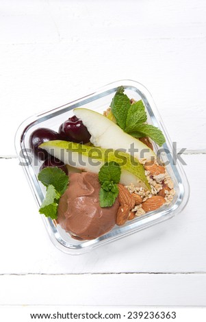 Kids lunch box: chocolate ricotta, pear, muesli with almonds,Ã?Â?Ã?Â unpitted cherry and mint