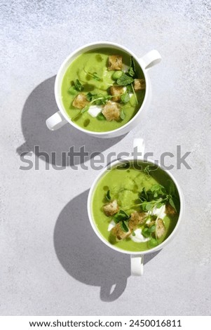 Similar – Foto Bild Leckere Erbsensuppe in Schüsseln auf dem Tisch