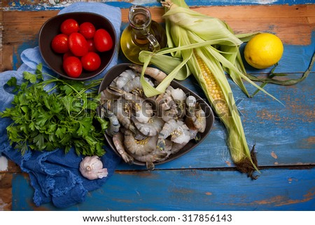 Raw prawns, tomatoes, parsley, corn, garlic, lemon and olive oil