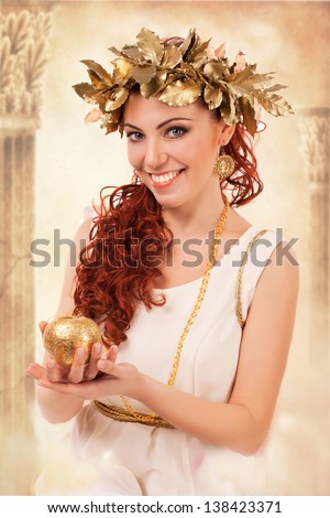 portrait of a greek goddess in white dress with the gold goddess