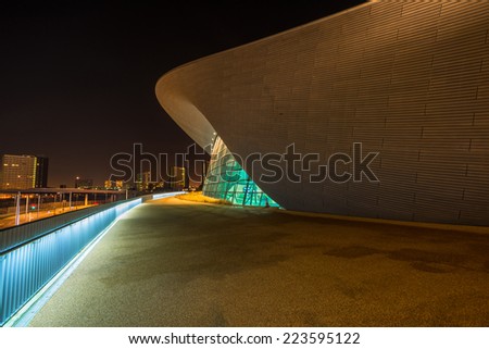 LONDON - October 11th 2014. Night view of The Aquatics Centre in Queen Elizabeth Olympic Park. The building was designed by Zaha Hadid Architects and now open to the public in Stratford, London, UK.
