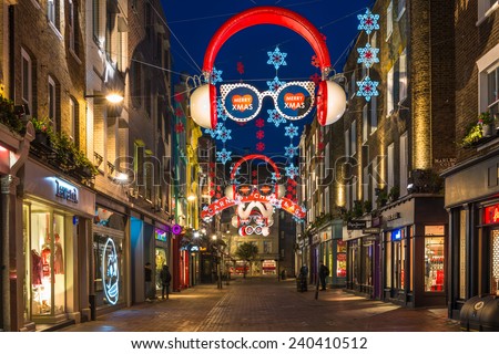 LONDON - DECEMBER 29th 2014: Christmas lights on Carnaby Street, London UK. Carnaby Christmas lights feature some of the most unusual Christmas decorations and lights in London.