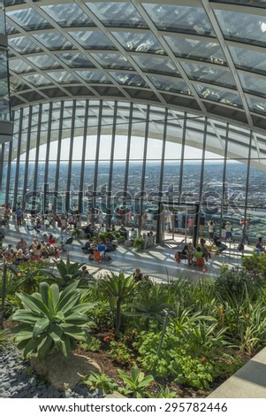 LONDON, UK - JULY 4, 2015: The Sky Garden at 20 Fenchurch Street is a unique public space designed by Rafael Vinoly Architects. It features a stylish restaurant; brasserie and cocktail bar