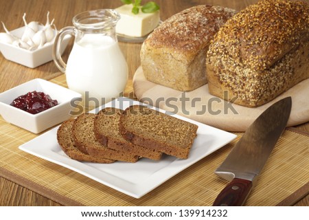 Breakfast with wholemeal bread and jam and milk
