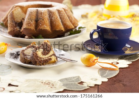 Easter marble ring cake with a cap of coffee - focus on a piece of cake