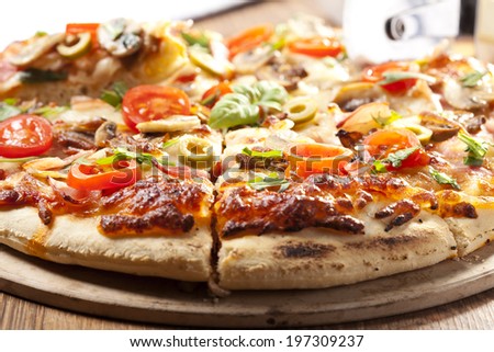 Pizza with ham and mushrooms on plate