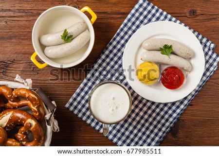 Similar – Image, Stock Photo German white sausage table top view. Bavarian veal sausage section