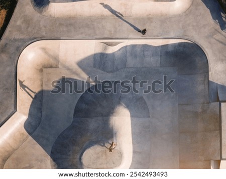 Similar – Image, Stock Photo Skater performing trick on ramp in skate park