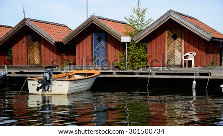 29.07.2015 - Rafsnas, Sweden - Old boat houses sit along the harbor in Rafsnas, Sweden