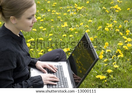 Young Woman Working On Computer Outside