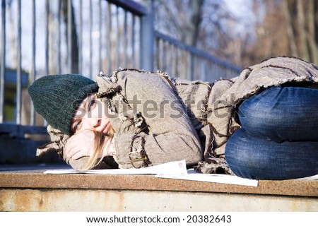 The Young Woman Lying On Asphalt. Economic crisis series.