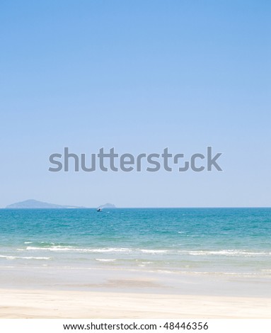 Summer beach background with clean sand  and blue sky