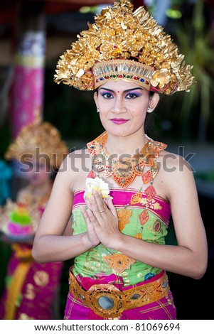 BATUBULAN, BALI, INDONESIA- JUNE 23: Unidentified women posing for tourists at the weekly  Barong Dance, the traditional balinese performance on June 23, 2011 in Batubulan, Bali, Indonesia.