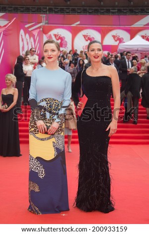 MOSCOW - JUNE, 19: Russian actress E.Vilkova with friend. 36th Moscow International Film Festival. Opening Ceremony at Pushkinsky Cinema . June 19, 2014 in Moscow, Russia