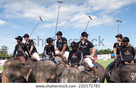 HUA HIN, THAILAND - AUGUST 28: Unidentified polo players at  elephant polo games during the 2013 King \'s Cup Elephant Polo match on August 28, 2013 at Suriyothai Camp in Hua Hin, Thailand.