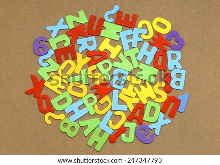 letters of the alphabet randomly arranged on a blackboard