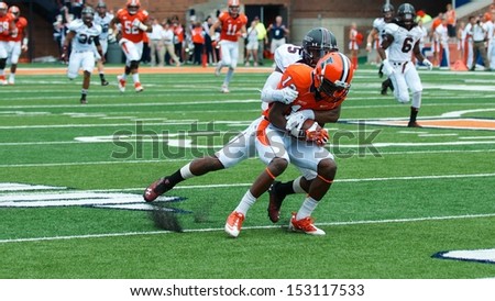 CHAMPAIGN,IL-AUGUST 31: Illinois wide receiver Ryan Lankford (12) is tackled by SIU corner back Terrell Wilson (5) during the first quarter of a game on Saturday, Aug 31, 2013.