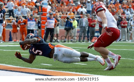 CHAMPAIGN,IL-SEPTEMBER 28: Fighting Illini running back Donovonn Young (5) dives for the end  zone in order to score a touch down on Saturday, Sept 28, 2013.