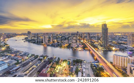 Landscape of River in Bangkok city in night time with bird view.