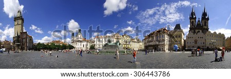 Walking people on Old Town Square of Prague panorama made at noon from Prague Meridian line on 06 july 2014