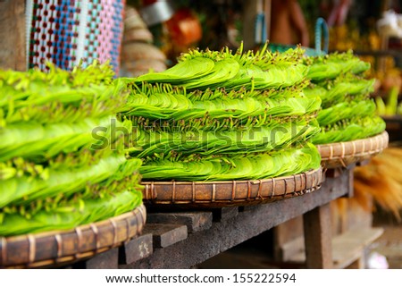 Betel leaf overlay on the basket in the market