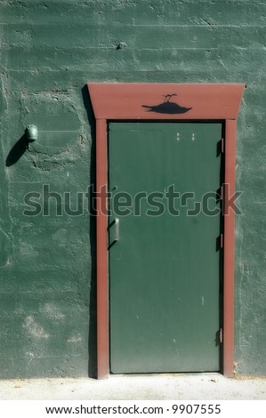 Green door in the green wall