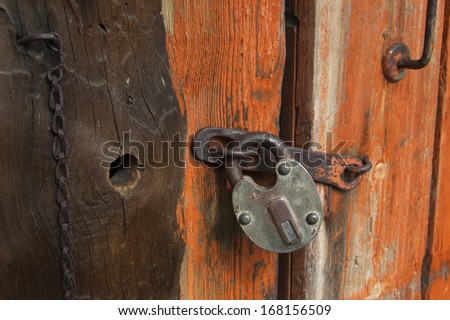Old wooden door with padlock,  fragment. From series backgrounds and textures