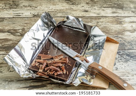 Bar of chocolate and shavings. From series  Prepare Italian Desserts