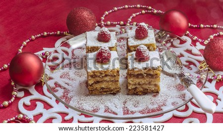 Holiday apple pie bars, garnished with fresh raspberries Near Christmas decorations.  From series Winter pastry