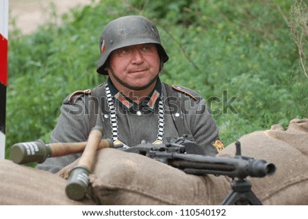 KIEV, UKRAINE -MAY 13: Member of Red Star history club wears historical German uniform during historical reenactment of WWII, May 13, 2012 in Kiev, Ukraine